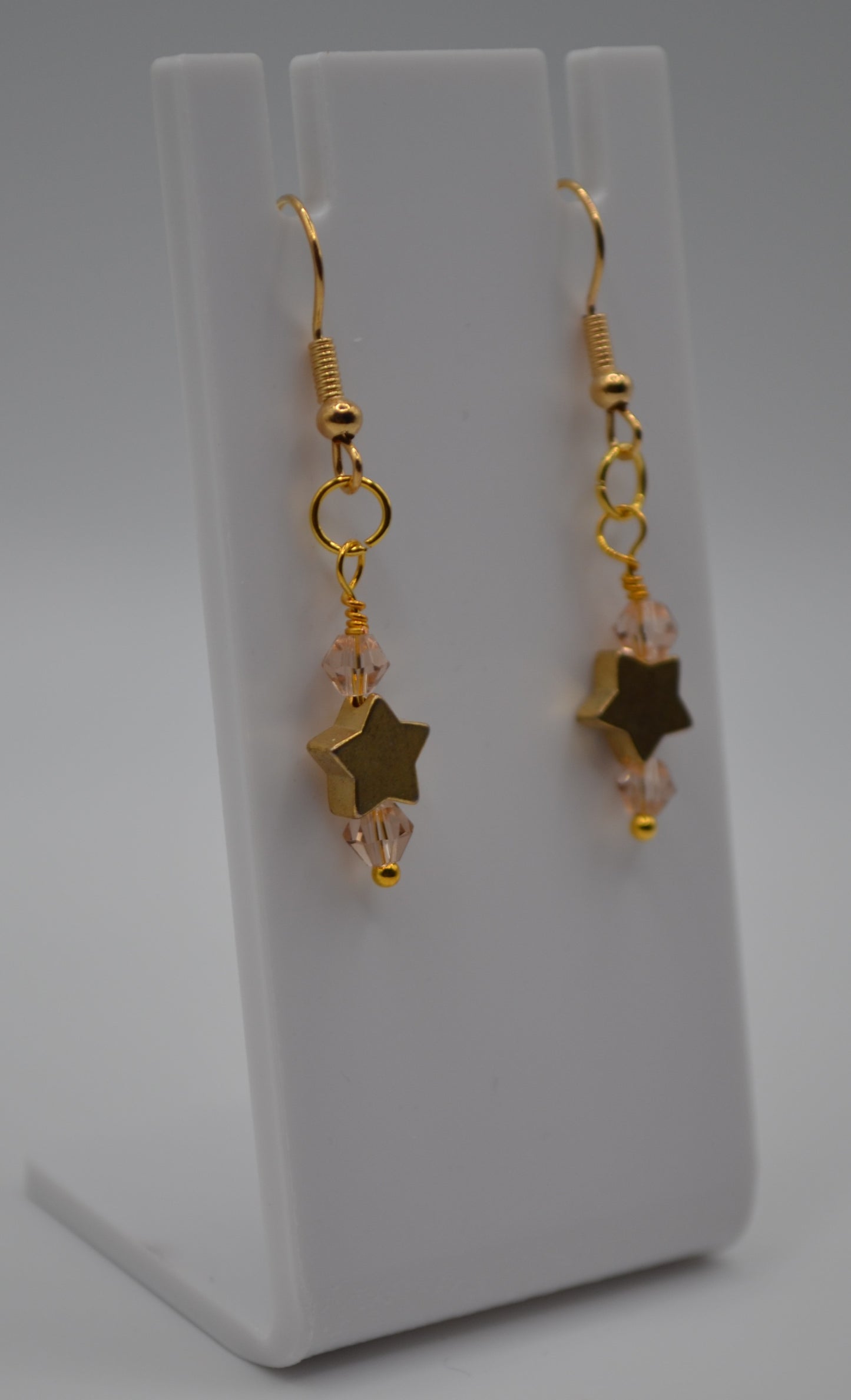 Pink gold star earrings