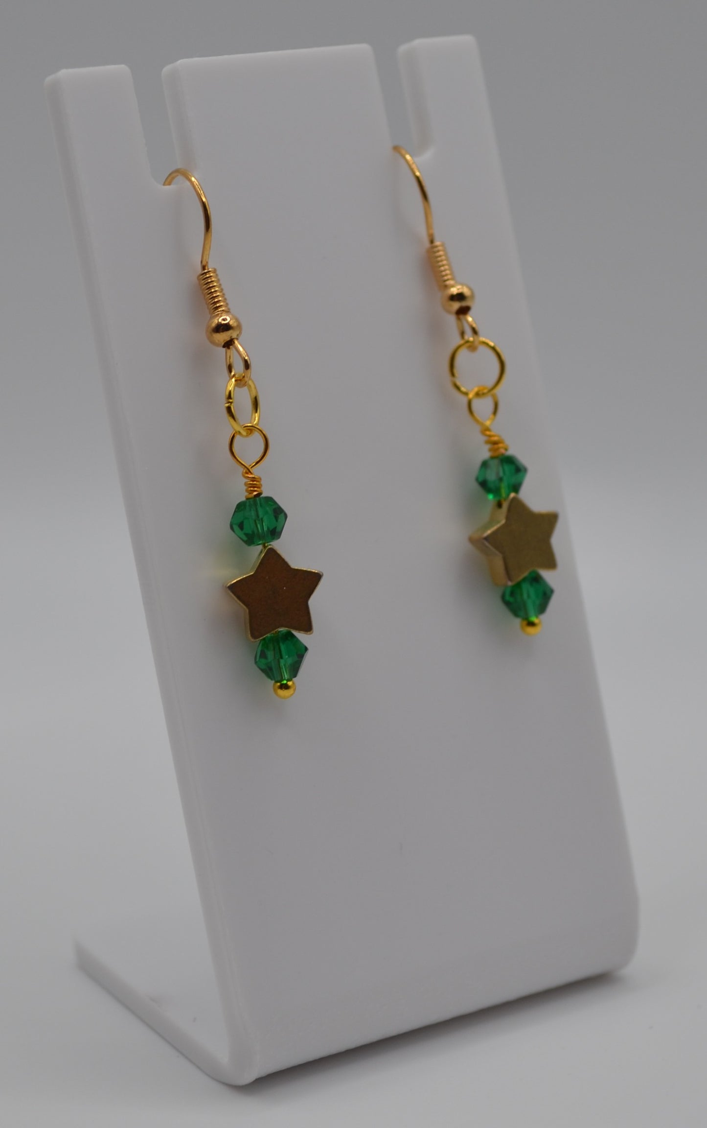 Emerald green gold star earrings