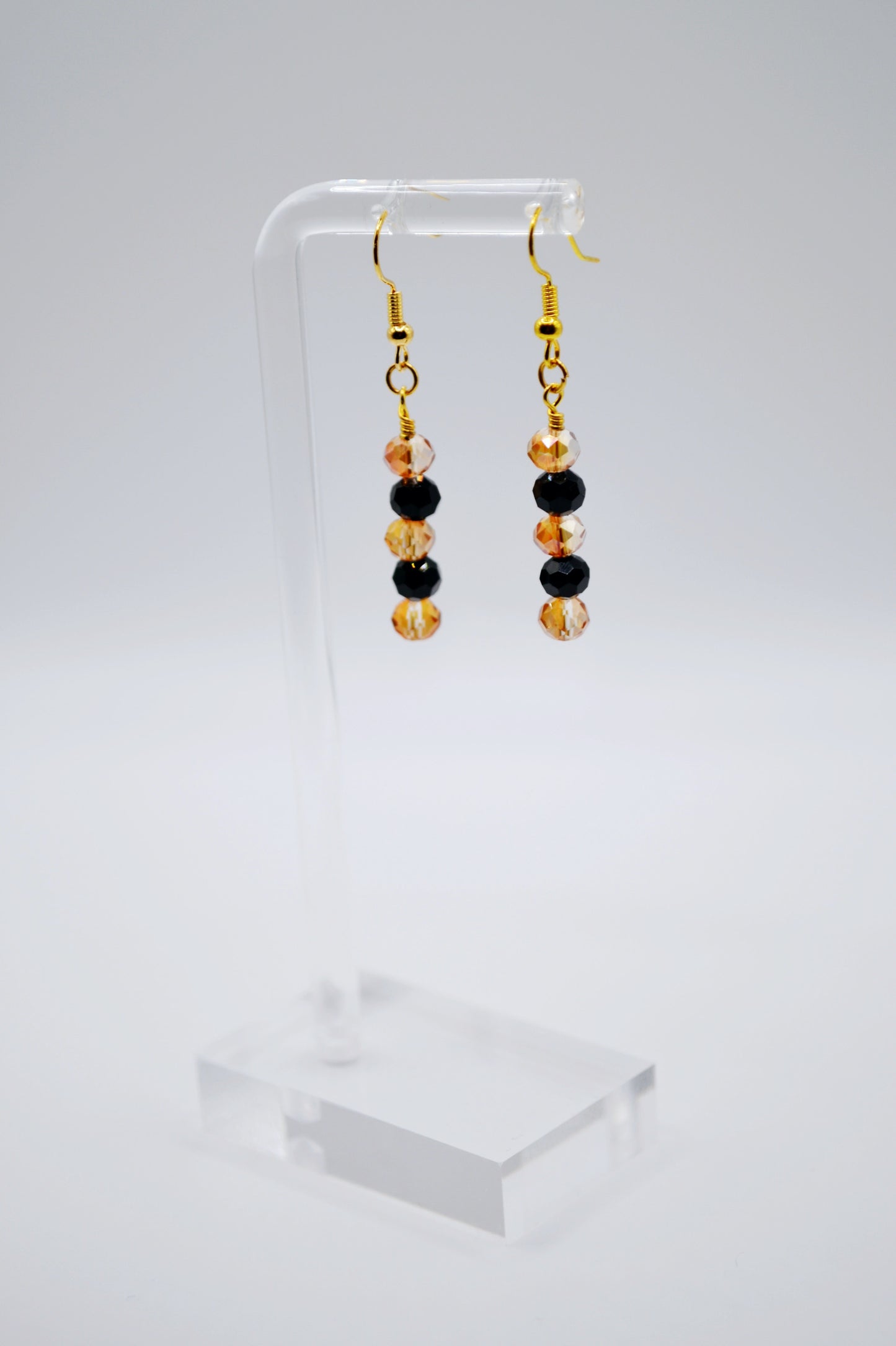 Black and orange beaded earrings