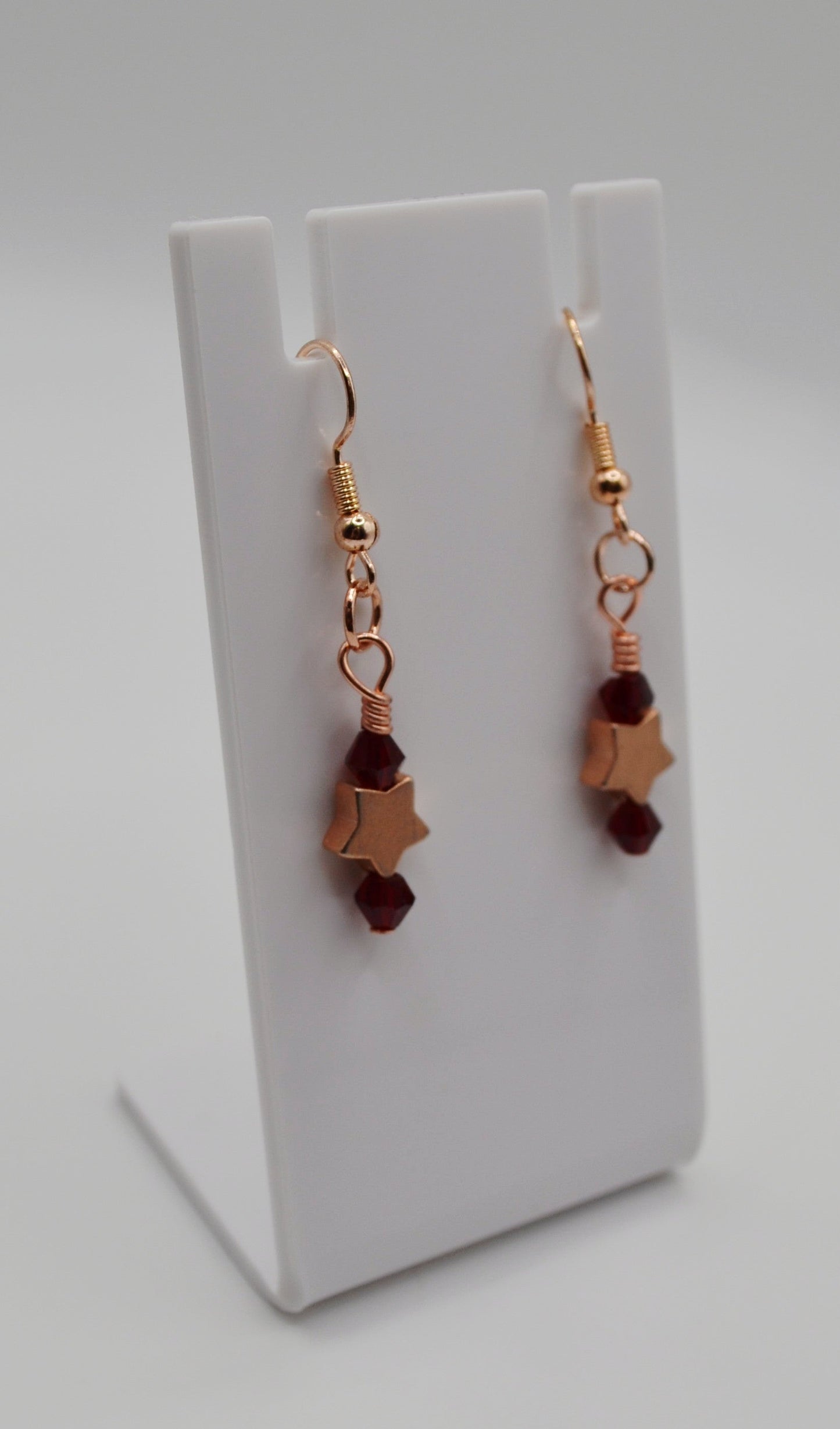 Burgundy rose gold star earrings