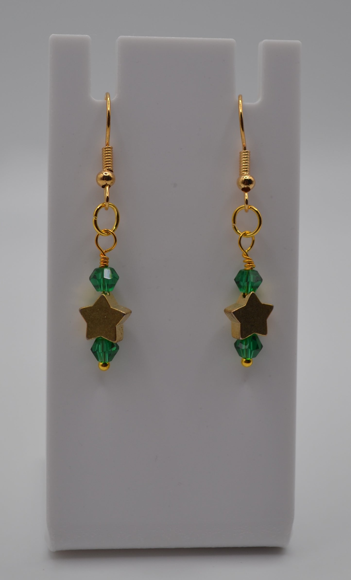 Emerald green gold star earrings