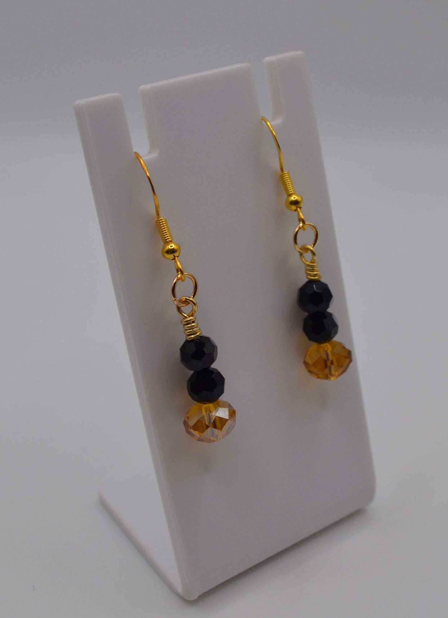 Orange and black dangle earrings