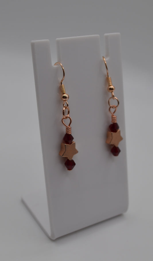 Burgundy rose gold star earrings