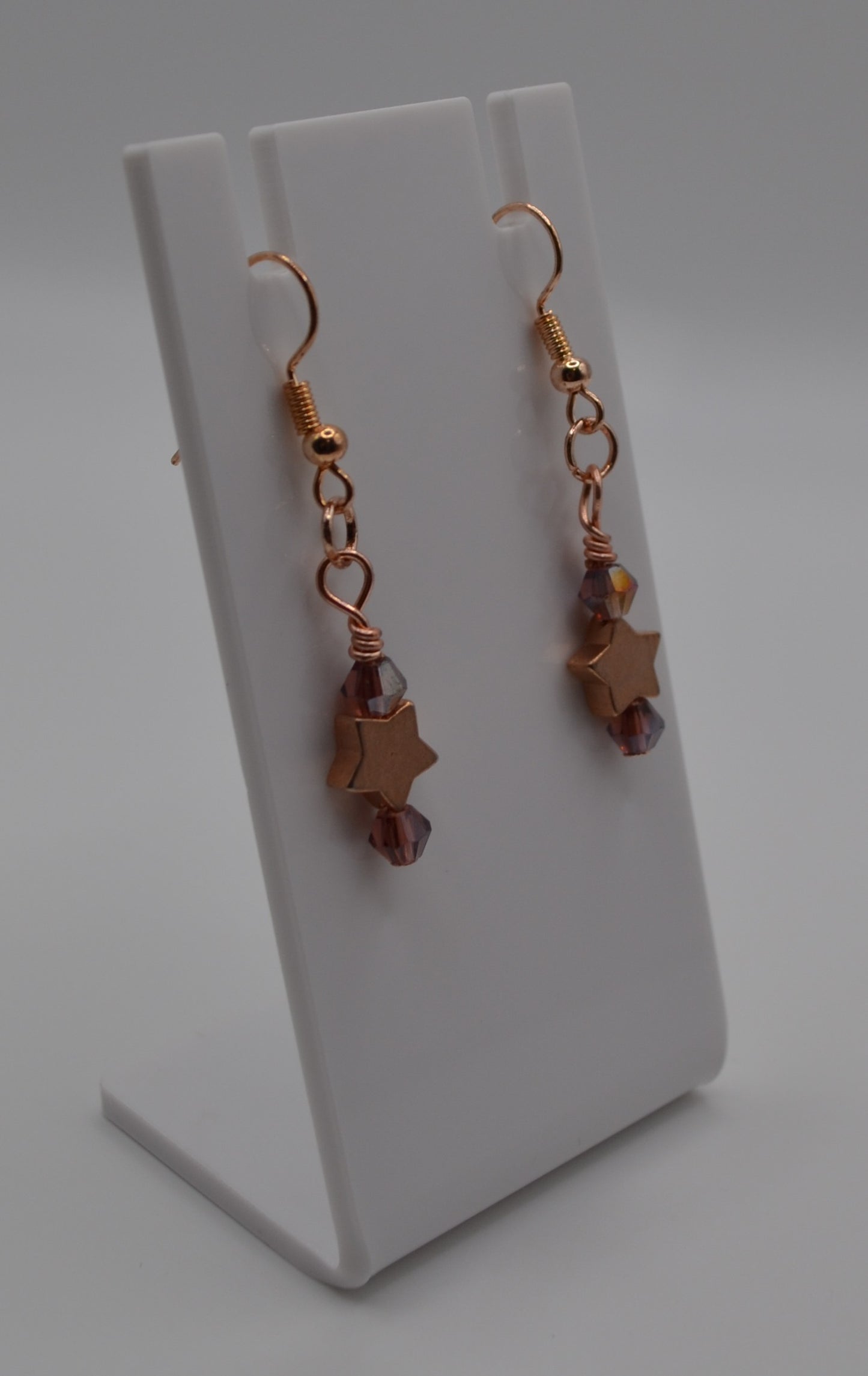 Dark purple rose gold star earrings