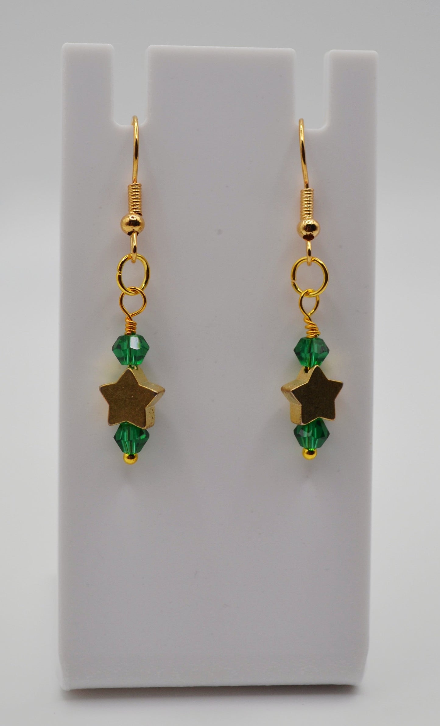 Emerald green gold star earrings