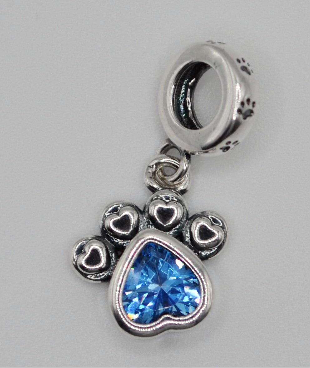 Blue dog paw charm