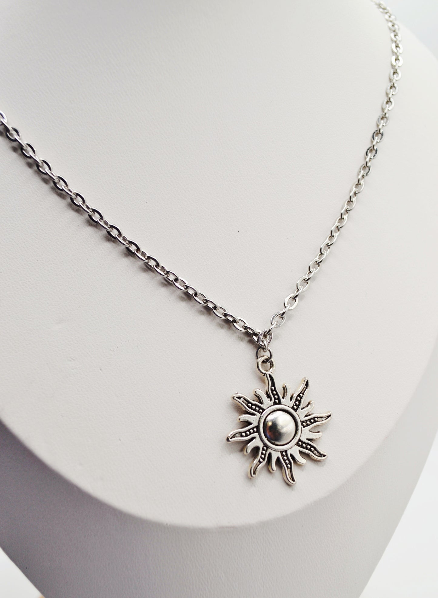 Silver sun pendant necklace