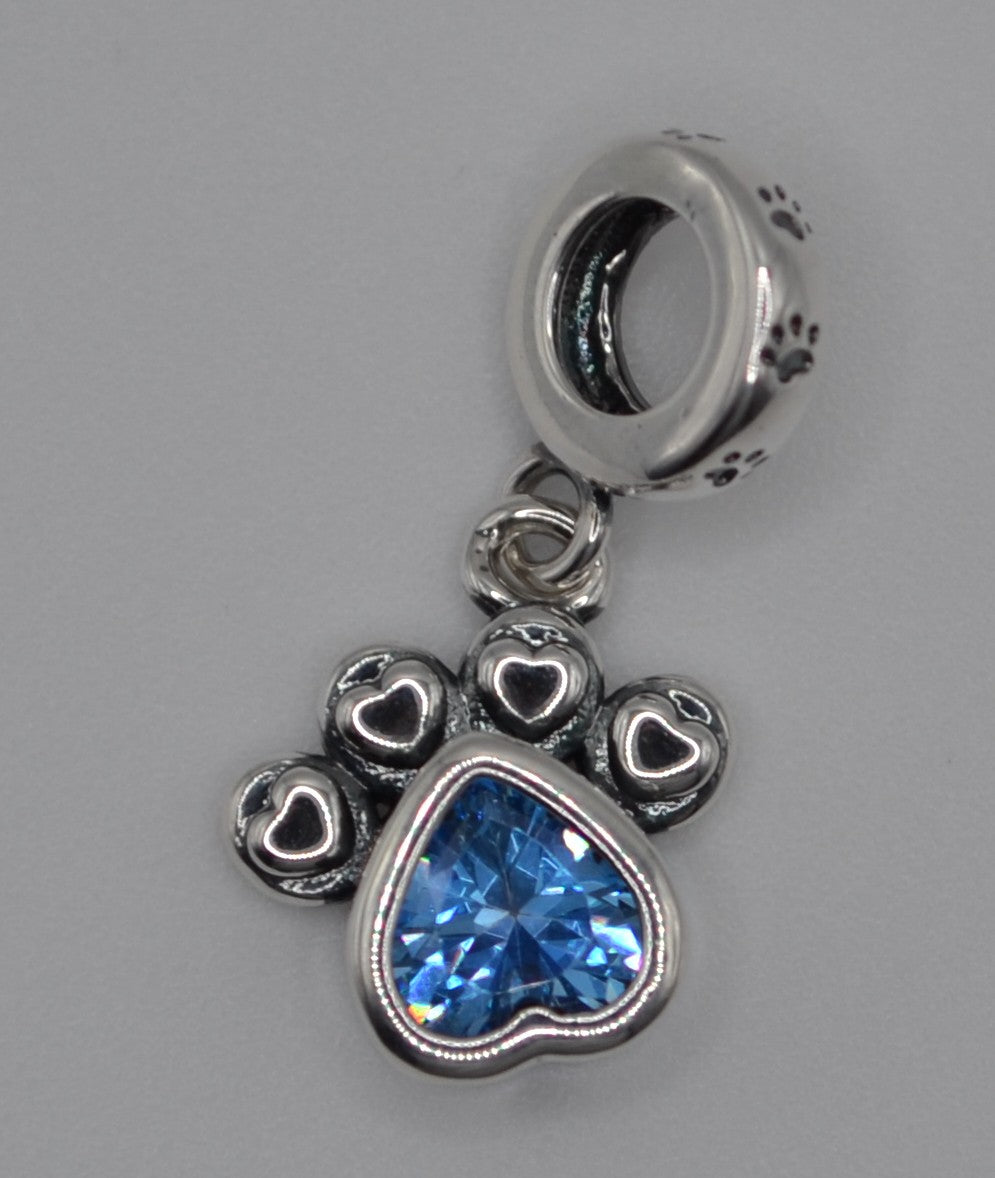 Blue dog paw charm